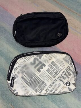 (2) Lululemon Everywhere Belt Bag 1L Regular strap Black White Manifesto & black